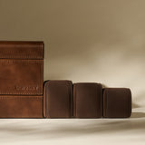 The TAWBURY Bayswater 12 Slot Watch Box with Storage in Chestnut Brown provides elegant organization for your timepieces, featuring multiple compartments and stylish design against a beige background.