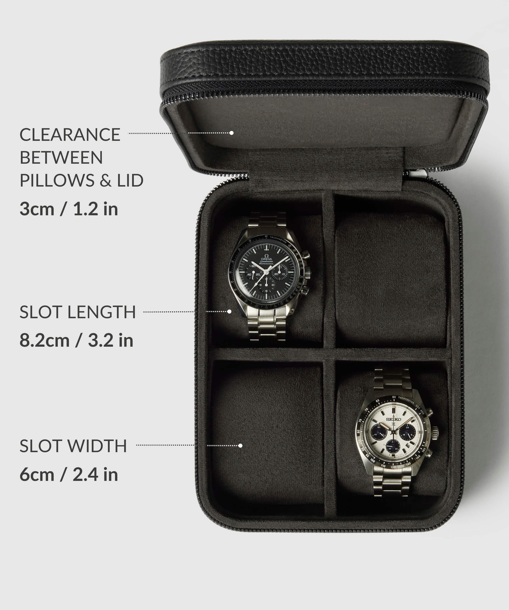 A TAWBURY Fraser 4 Watch Travel Case - Black (Coming Soon) from the Fraser Collection is open, displaying two watches. Measurements: 3cm clearance, 8.2cm slot length, 6cm slot width.