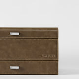 Close-up of the TAWBURY Bayswater 8 Slot Watch Box in taupe, featuring visible stitching, two metal handles, and "TAWBURY" embossed on the lower right—perfect for elegant watch storage.