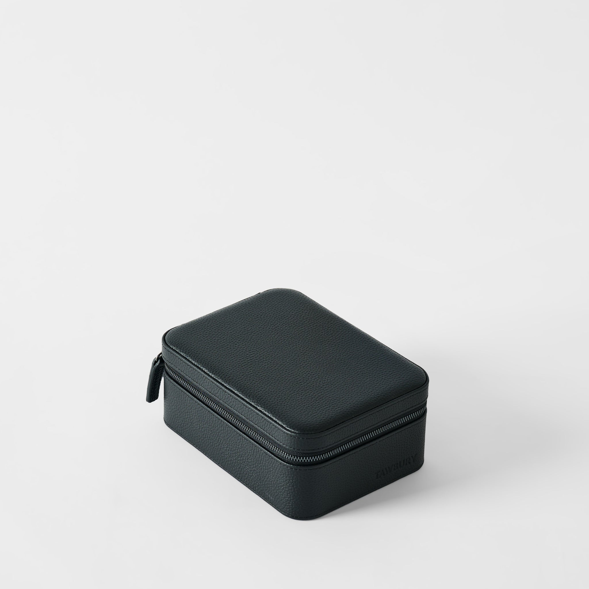 The TAWBURY Fraser 4 Watch Case - Midnight Black is a closed, rectangular case with a textured black leather finish, ideal for securely storing up to 4 watches during travel.