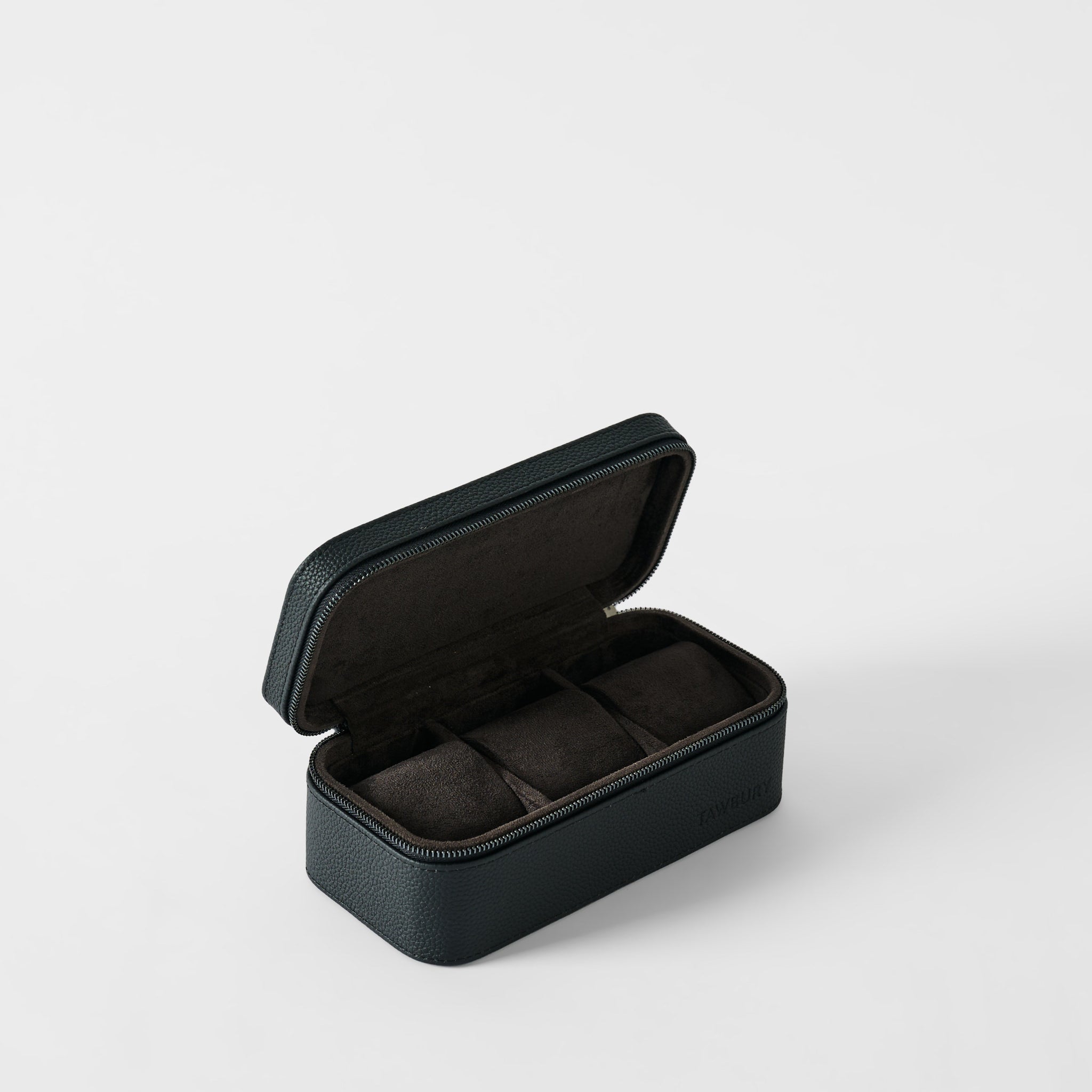 The Fraser 3 Watch Case - Midnight Black by TAWBURY features a hinged, black textured leather exterior and three dark fabric-lined compartments—ideal travel storage for your watch collection.