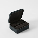 The TAWBURY Fraser 3 Watch Case with Storage in Midnight Black features a hinged lid and opens to reveal three dark suede-lined compartments.