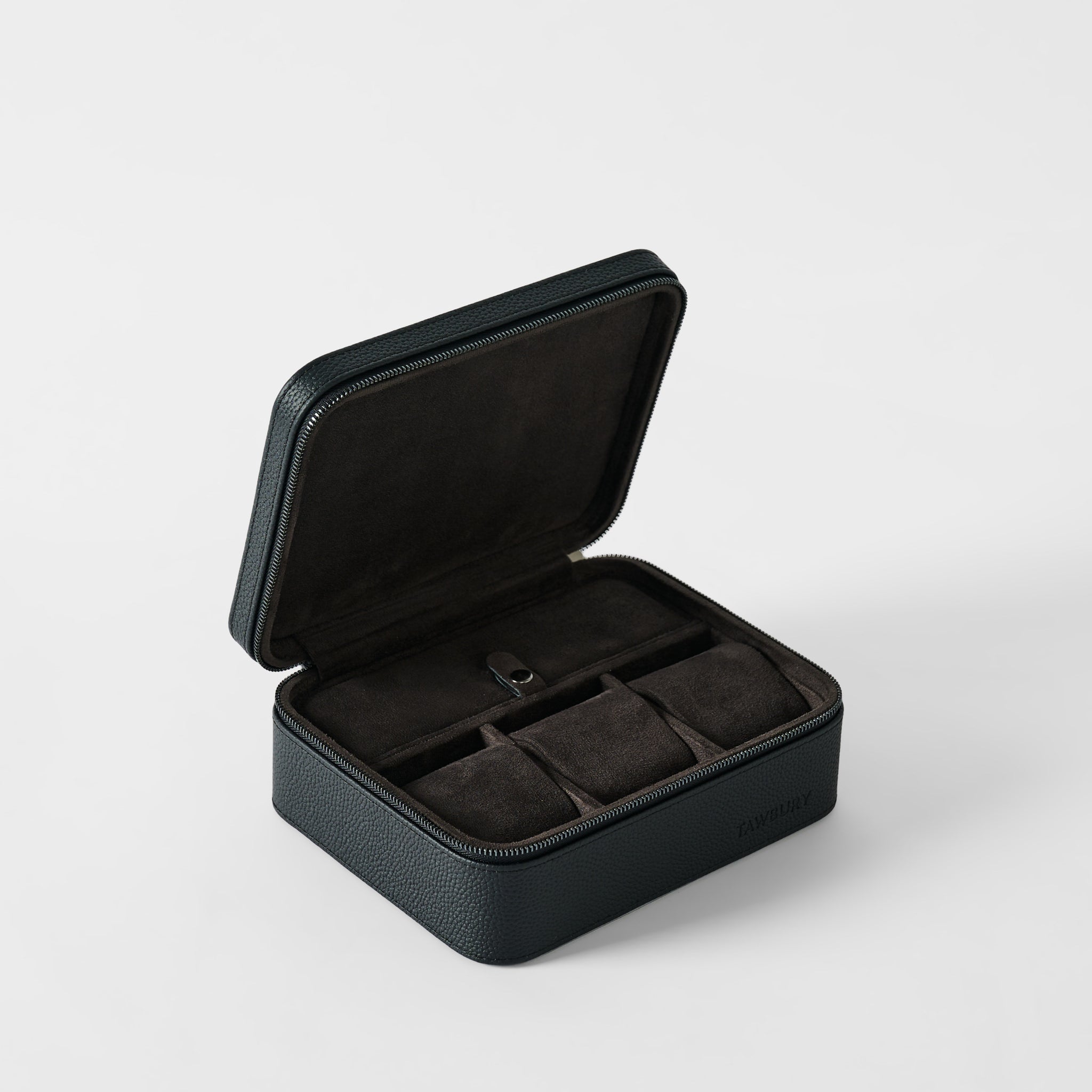 The TAWBURY Fraser 3 Watch Case with Storage in Midnight Black features a hinged lid and opens to reveal three dark suede-lined compartments.