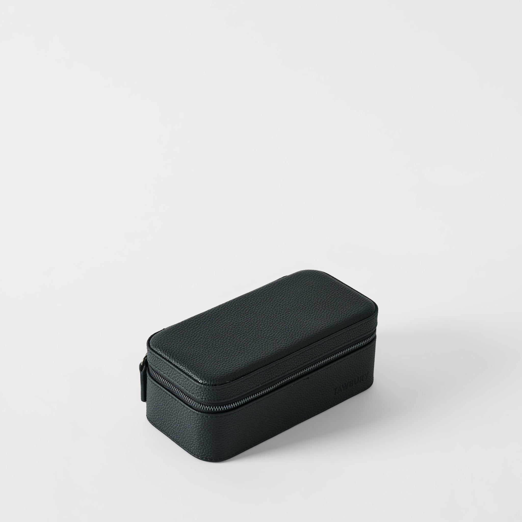 The TAWBURY Fraser 3 Watch Case in Midnight Black features textured leather, a secure zipper, and a rectangular design—perfect for stylish travel watch storage.