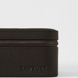 A close-up of the TAWBURY Fraser 4 Watch Case in brown textured leather, embossed with "TAWBURY" on the front—ideal for stylish storage or travel with up to 4 watches.