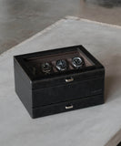 A TAWBURY Bayswater 8 Slot Watch Box with Drawer - Black, covered in sleek vegan leather, housing multiple watches within a stylish black box.