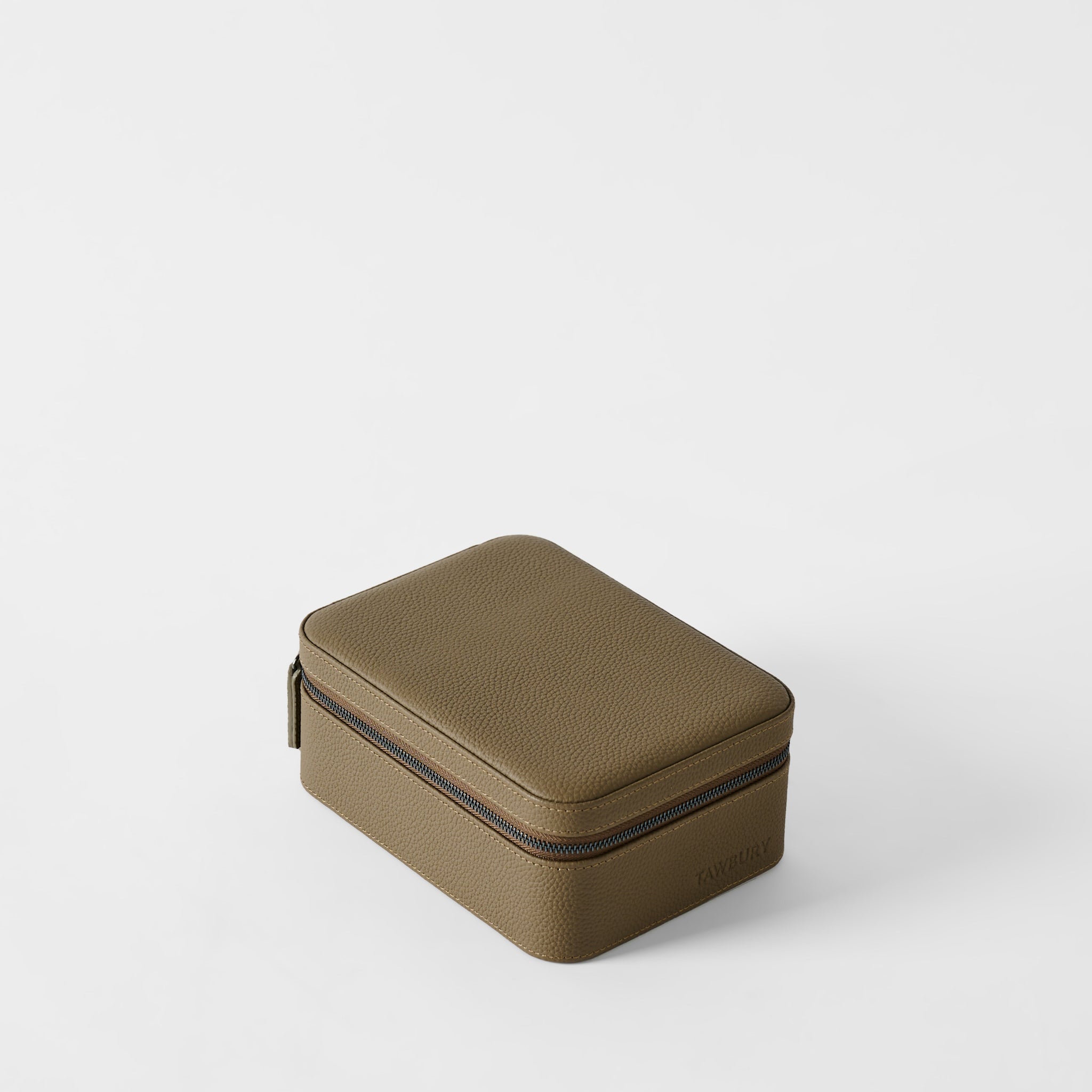 The TAWBURY Fraser 4 Watch Case in Truffle Taupe features textured brown leather and a zipper, shown closed on a plain white background. It’s designed to securely store up to 4 watches.