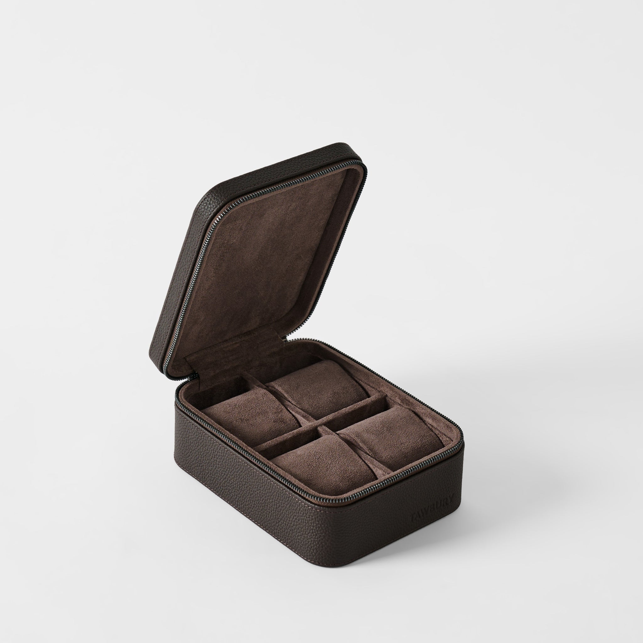 The TAWBURY Fraser 4 Watch Case in Espresso Brown features four cushioned compartments with an open lid design—ideal as a stylish travel case to keep your watch collection safe and organized.