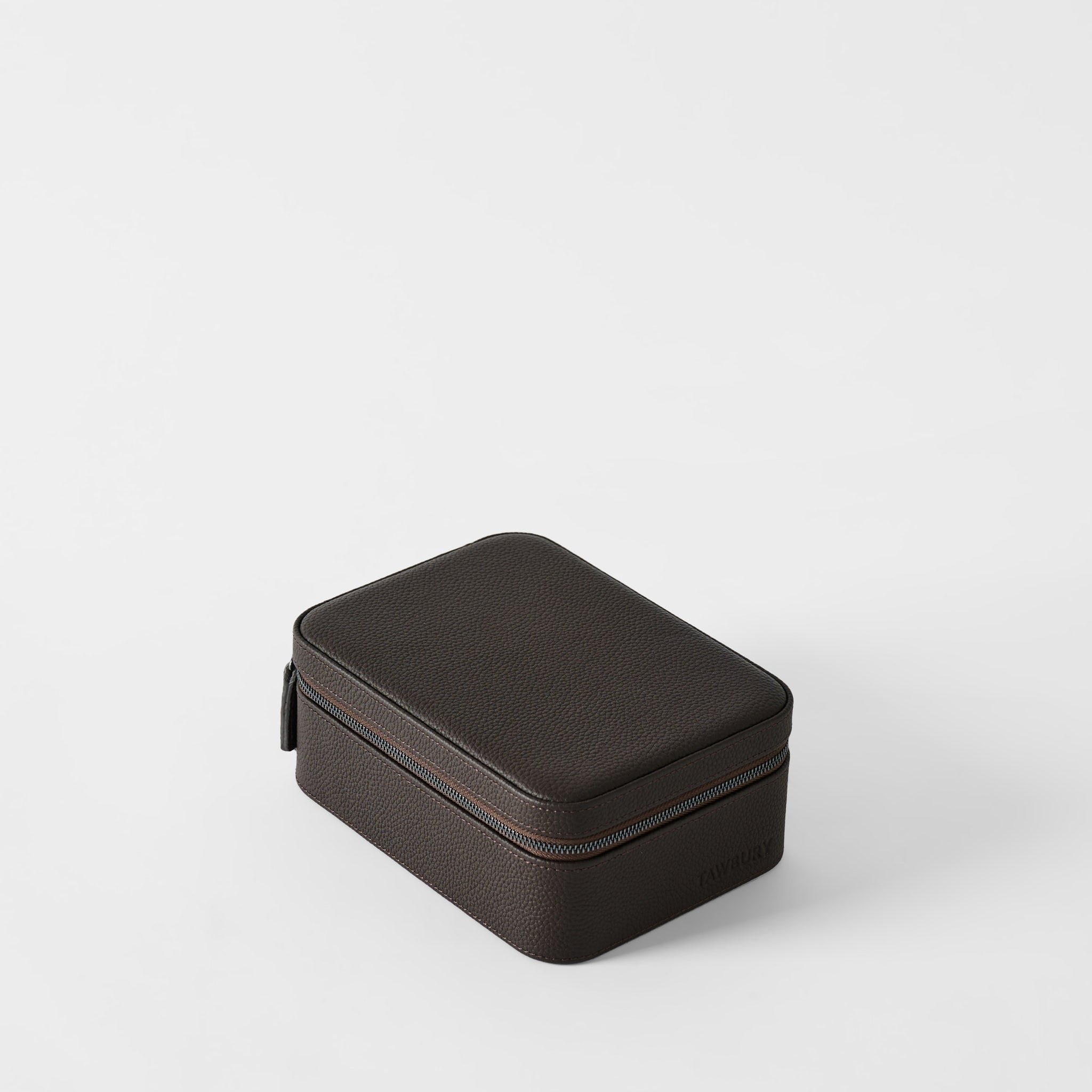 The TAWBURY Fraser 4 Watch Case in espresso brown features a rectangular textured leather design with rounded edges for secure storage of four watches, displayed on a plain white surface.