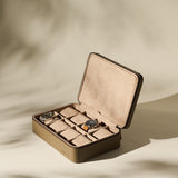 The TAWBURY Fraser 8 Watch Case in taupe leather is shown open, displaying two wristwatches and multiple empty compartments against a neutral background.