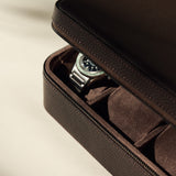 The TAWBURY Fraser 6 Watch Case in brown leather features a zipper for secure closure and stylishly protects your wristwatch collection with elegance and ease.