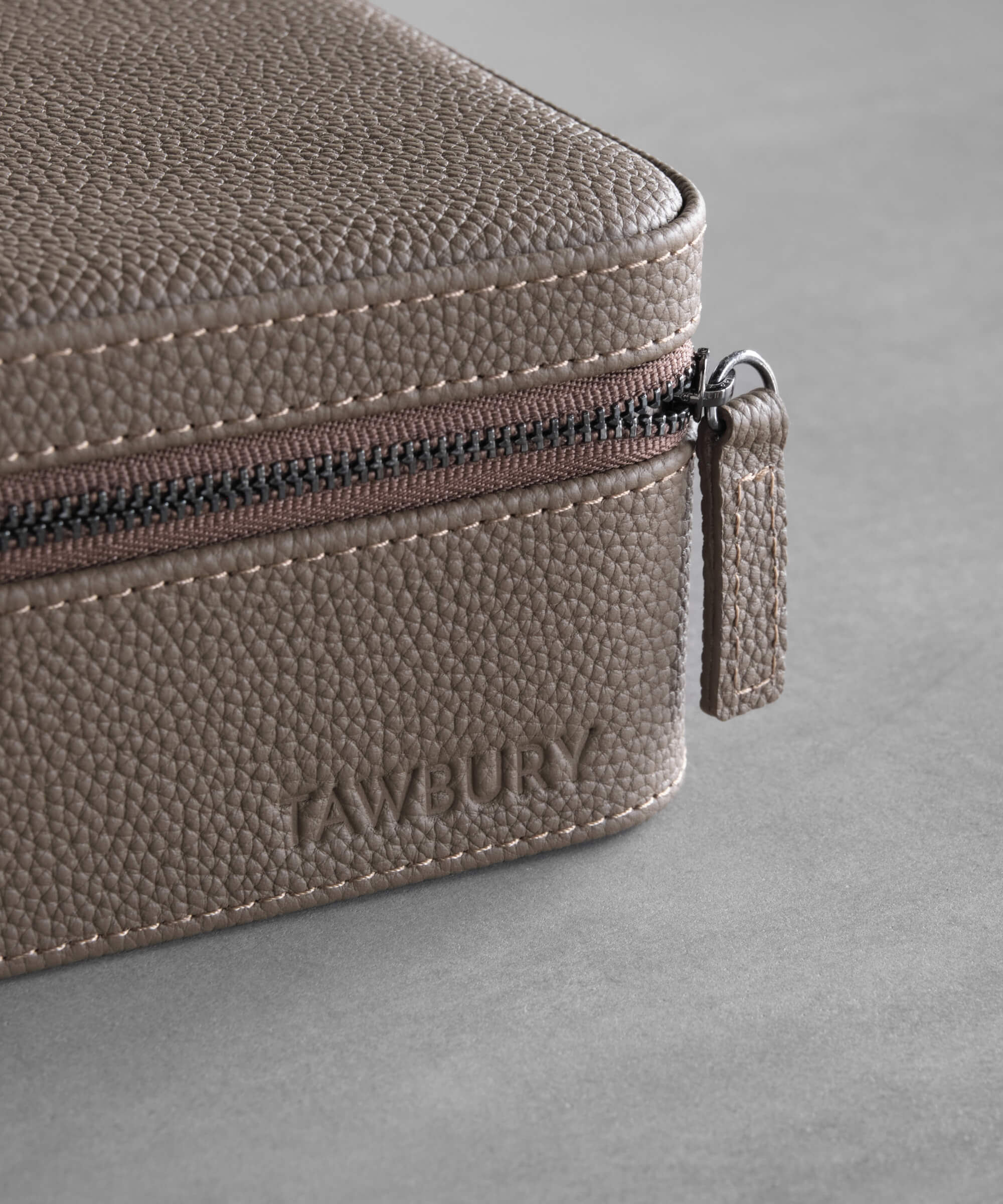 A Fraser 3 Watch Travel Case - Taupe by TAWBURY with a zipper for easy travel and storage.