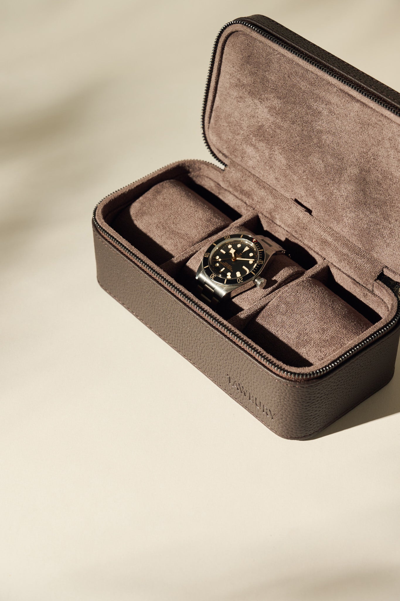 The TAWBURY Fraser 3 Watch Case in brown features multiple compartments for organizing your watches, making it an ideal travel storage solution.