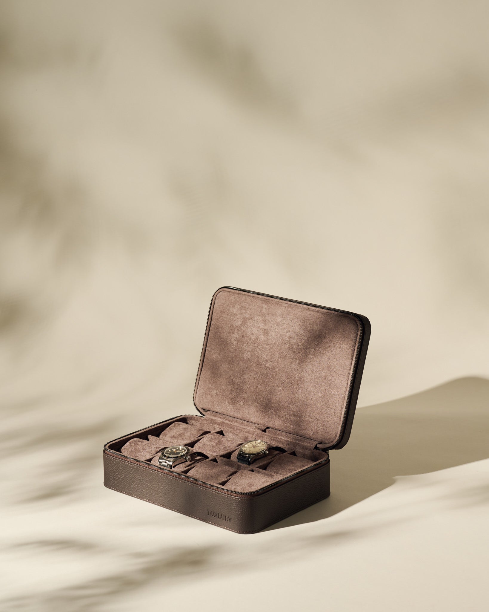 The TAWBURY Fraser 8 Watch Case in brown is open on a neutral background, beautifully displaying its elegant suede leather design and premium watch storage.