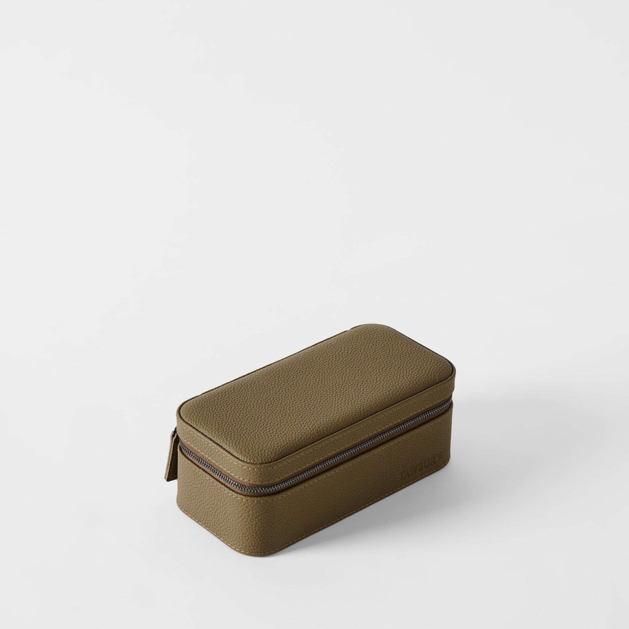 The TAWBURY Fraser 3 Watch Case in Truffle Taupe, featuring a rectangular zippered design and textured finish, is displayed on a plain white surface.