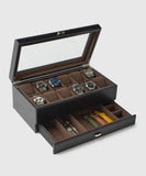 The Bayswater 12 Slot Watch Box with Storage by TAWBURY is essential for watch lovers, showcasing an open display for twelve watches on top and a vegan leather drawer below to organize watch straps and tools efficiently.