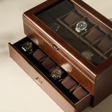 The TAWBURY Bayswater 24 Slot Watch Box with Drawer in brown features a glass lid and two-level padded compartments, offering secure, organized storage for your watch collection.