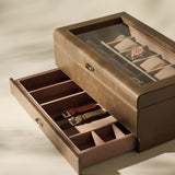 The TAWBURY Bayswater 12 Slot Watch Box with Storage in Taupe features a glass lid to showcase your watches, while the open drawer below offers extra compartments, making it the ideal stylish and practical organiser for your collection.