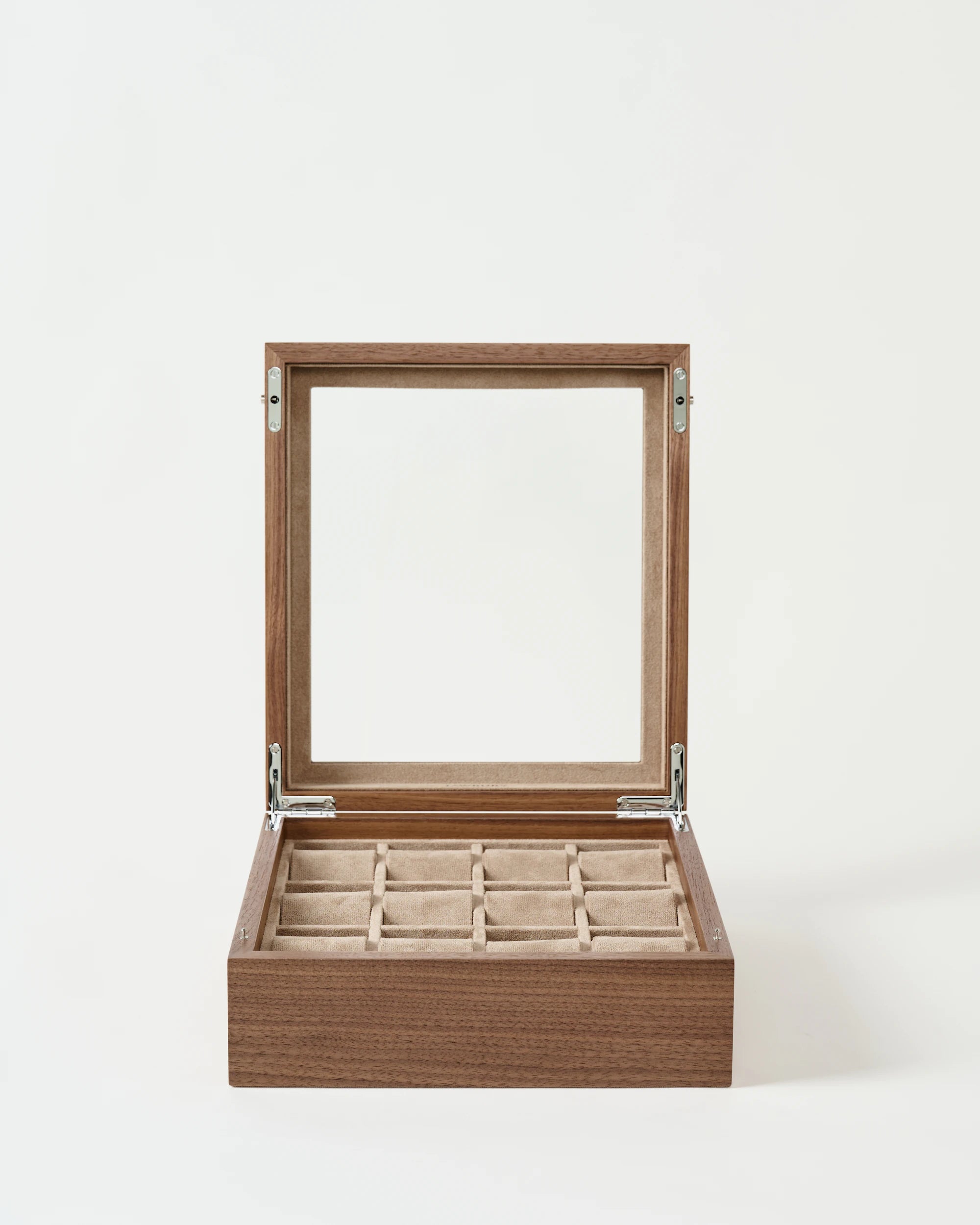 The TAWBURY Grove 12 Slot Wooden Watch Box in light walnut features a glass lid and nine beige compartments, shown open on a plain white background.