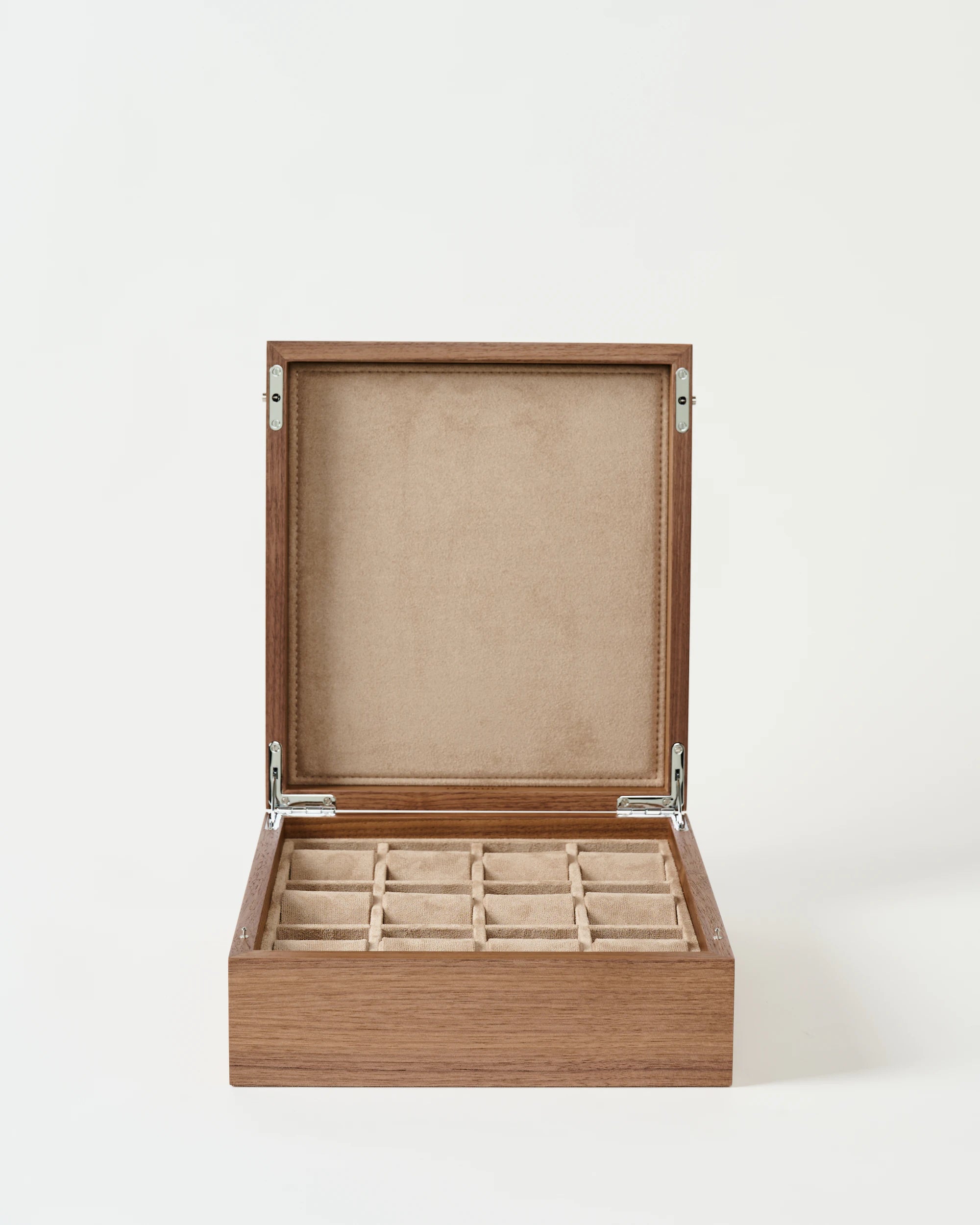 The TAWBURY Grove 12 Slot Wooden Watch Box in light walnut wood has a solid lid and beige velvet-lined square compartments for your watches.
