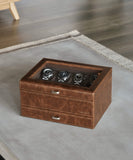A TAWBURY Bayswater 8 Slot Watch Box with Drawer in brown leather sitting on a table.