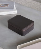 A small TAWBURY Fraser 3 Watch Travel Case with Storage - Brown sitting on top of a table.