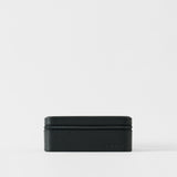 The TAWBURY Fraser 6 Watch Case - Midnight Black features a textured black leather design with a zipper closure, ideal for storing watches. It is displayed against a plain white background.