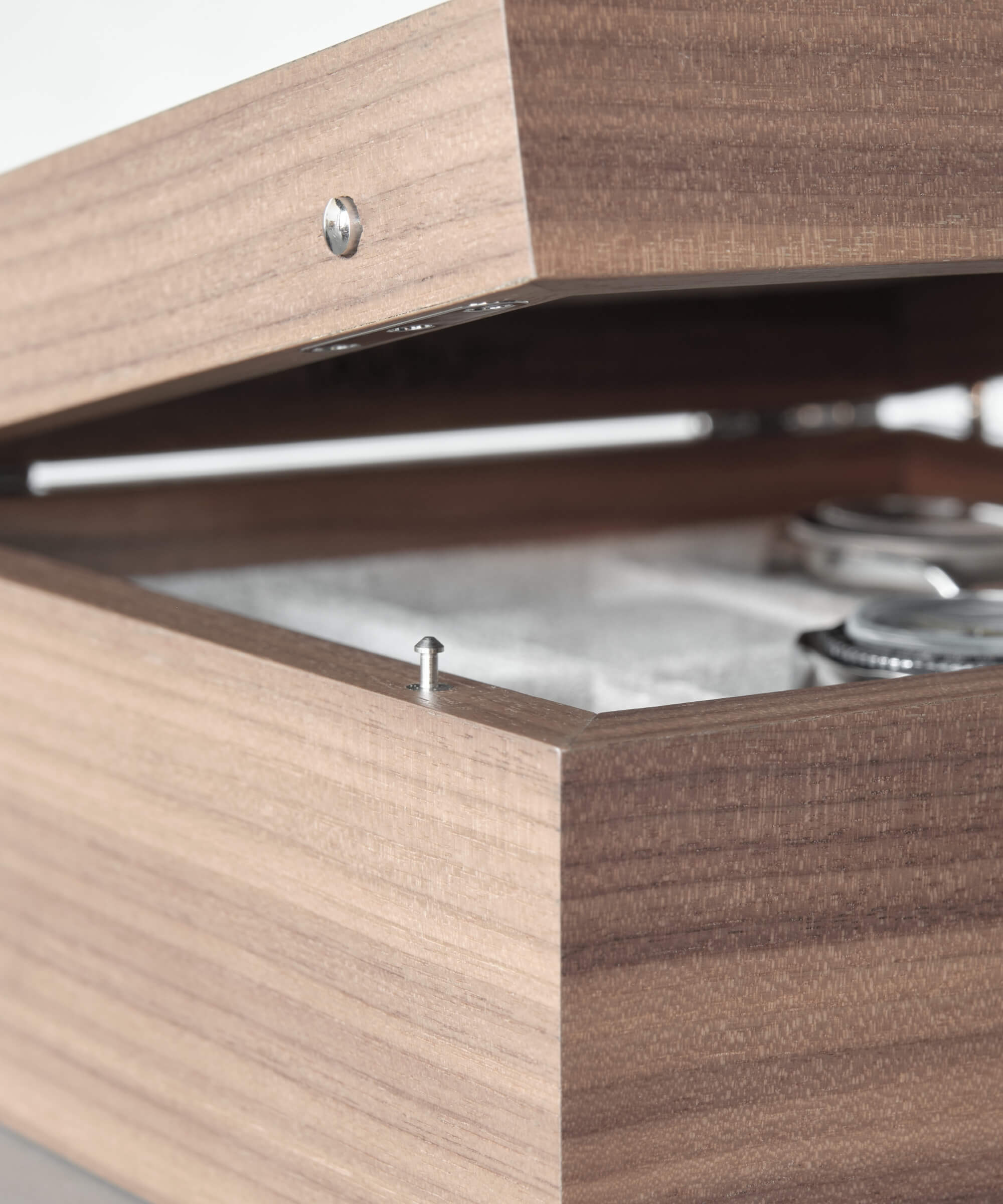The TAWBURY Grove 6 Slot Watch Box with Solid Lid - Walnut is an elegantly crafted wooden box perfect for watch collections. This exquisite timepiece storage solution will keep your prized watches safe and secure while adding a touch of sophistication.