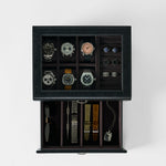 The TAWBURY Bayswater 6 Watch Jewelry Box in Black/Charcoal stores six watches, four pairs of cufflinks, two rings, sunglasses, three straps, a bracelet, and a dog tag—perfect for organized and elegant storage.