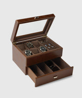 The TAWBURY Bayswater 6 Watch Jewellery Box in luxurious brown is ideal for watch enthusiasts. Featuring an open lid to display watches and rings, along with a drawer below for sunglasses, it effortlessly blends elegance with practicality.