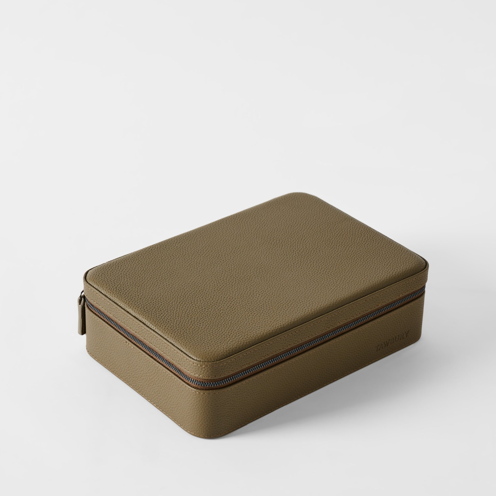 The TAWBURY Fraser 8 Watch Case in Truffle Taupe features a rectangular textured leather design with a zipper closure, shown closed on a white background—perfect for organizing up to 8 watches.