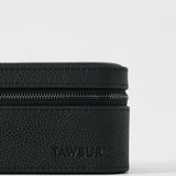 A close-up of the TAWBURY Fraser 3 Watch Case in black, featuring a textured zippered design and "TAWBURY" embossed on the front—crafted for stylish, secure travel watch storage.