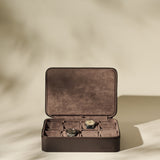 The TAWBURY Fraser 8 Watch Case in brown features a suede interior, stores up to eight watches, and is displayed open against a neutral background.
