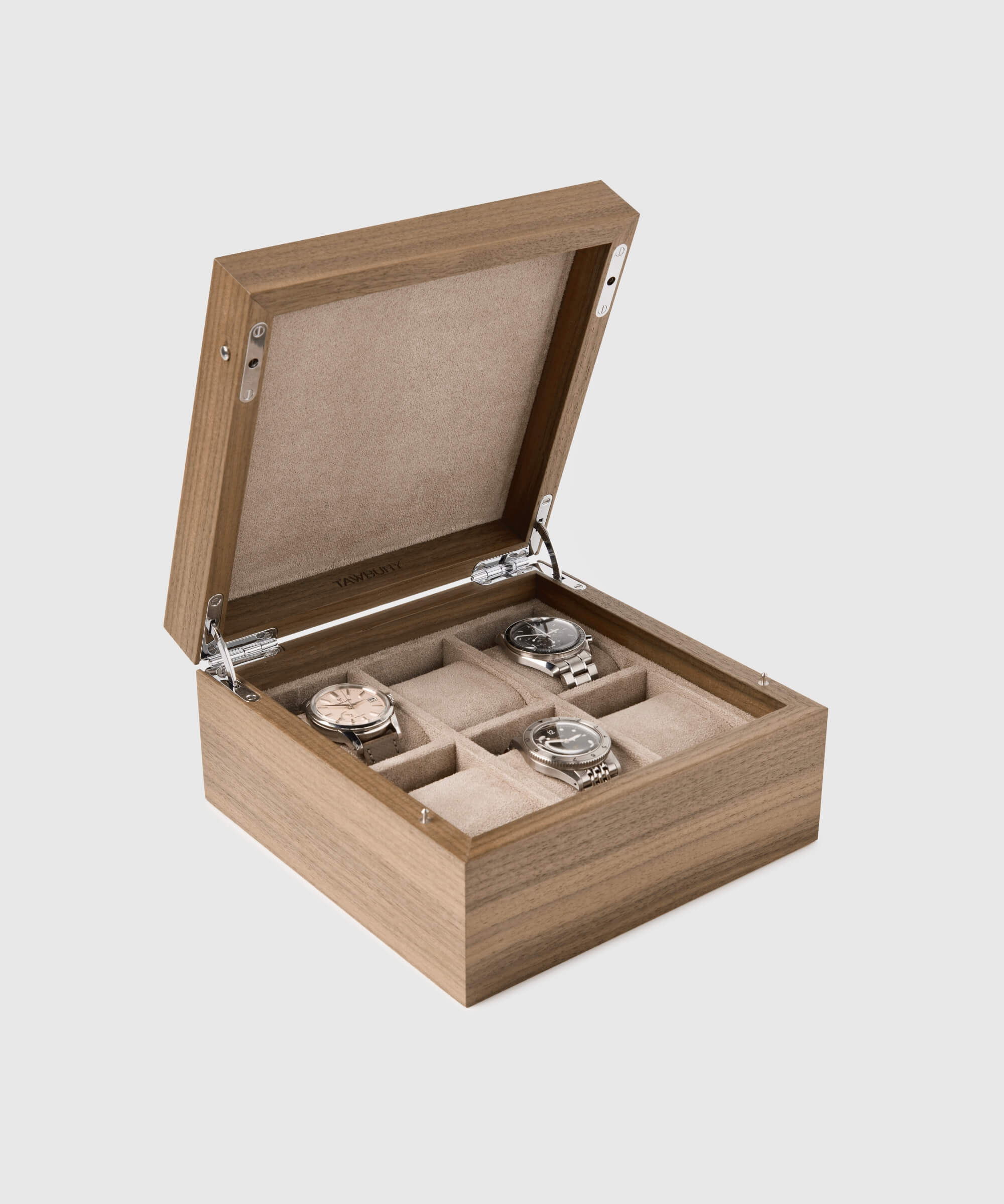 The TAWBURY Grove 6 Slot Watch Box with Solid Lid - Walnut is a sleek wooden watch box perfect for organizing and displaying watch collections. It comes with four exquisite timepieces encased within.
