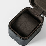 The TAWBURY Fraser 1 Watch Case - Black is shown open and empty, with a zipper and dark brown velvet-like lining, photographed on a white background.
