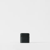 The TAWBURY Fraser 1 Watch Case in Midnight Black is a compact, textured leather case set against a plain white background—ideal for storing your watch while traveling.