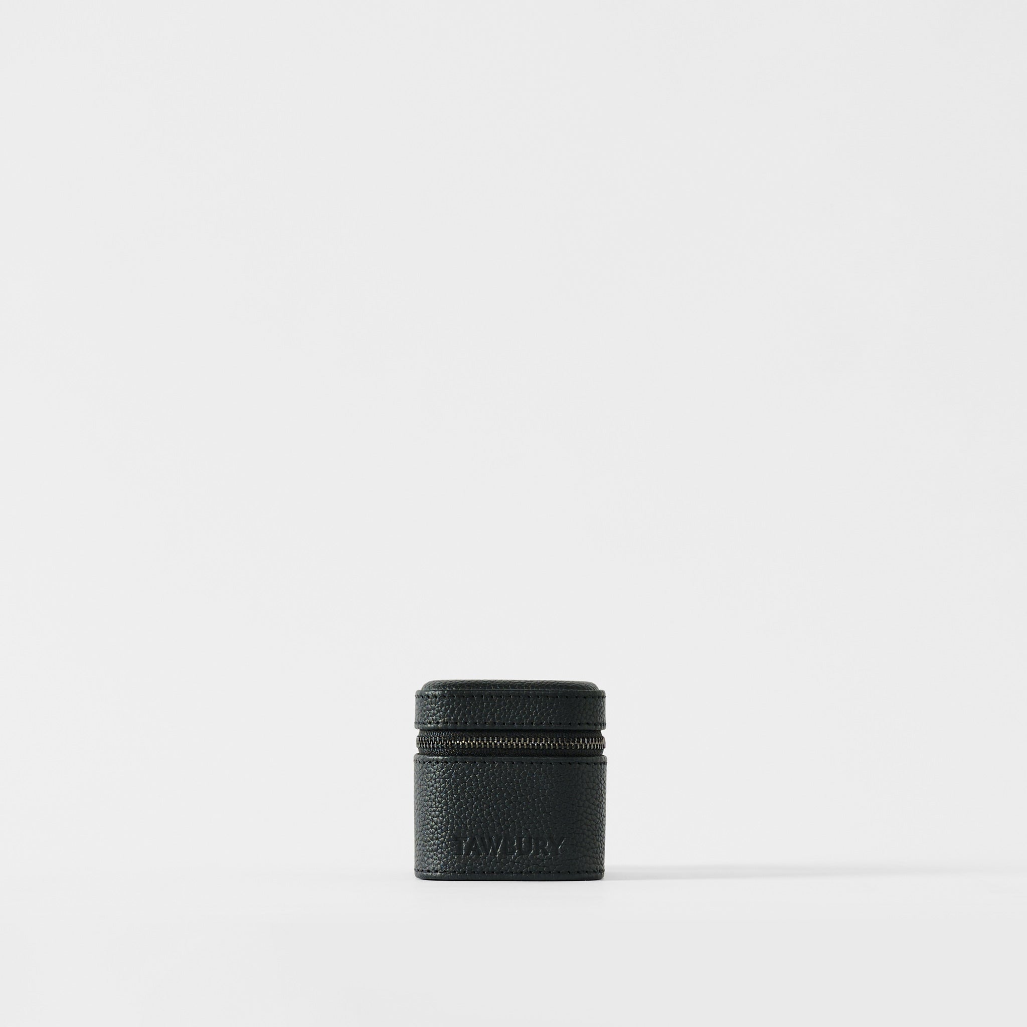 The TAWBURY Fraser 1 Watch Case in Midnight Black is a compact, textured leather case set against a plain white background—ideal for storing your watch while traveling.