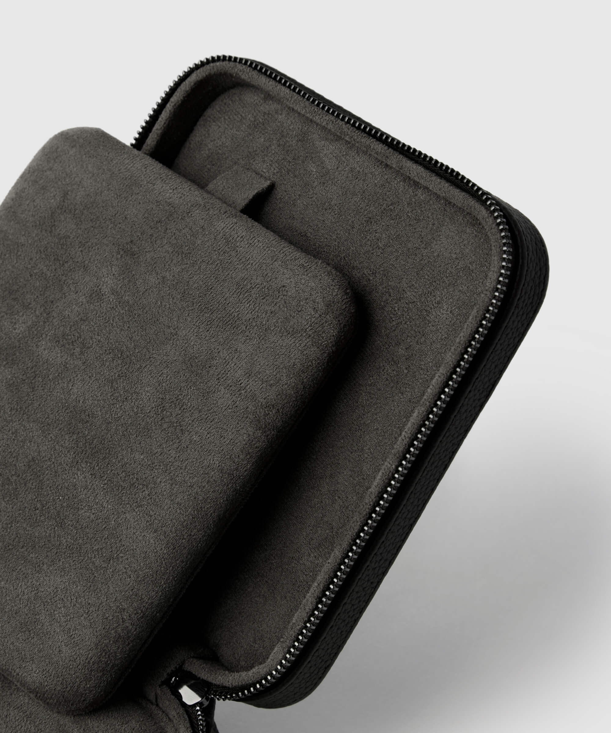 A close-up of an open TAWBURY Fraser 4 Watch Travel Case - Black (Coming Soon) with a fabric lining, showing the top lid and an inner compartment designed for elegant protection.