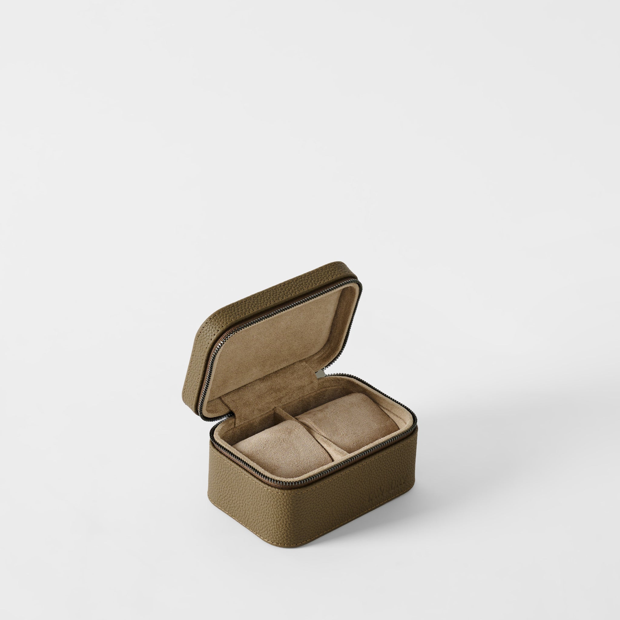 The TAWBURY Fraser 2 Watch Case in Truffle Taupe features a brown textured leather finish and an open lid displaying two cushioned compartments, set against a plain white background.