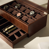 The TAWBURY Bayswater 12 Slot Watch Box with Storage in brown features multiple compartments, holds up to 12 wristwatches, and includes a lower drawer for watch straps.