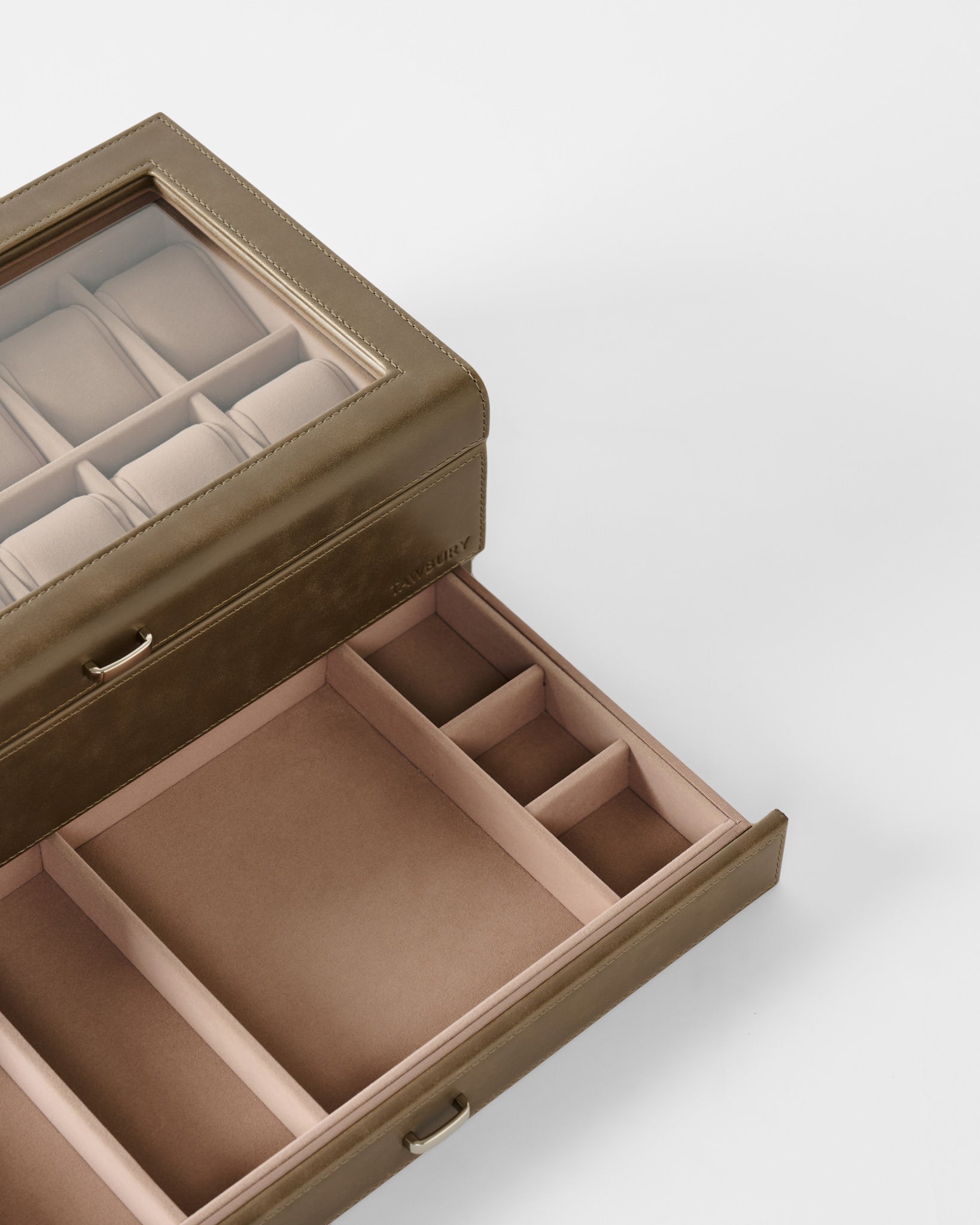 The TAWBURY Bayswater 12 Slot Watch Box with Storage in taupe features a glass lid and multiple compartments for organized watch and accessory storage.
