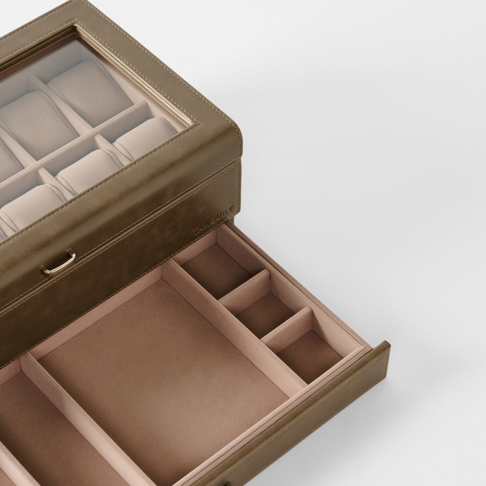 The TAWBURY Bayswater 12 Slot Watch Box with Storage in taupe features a glass lid and multiple compartments for organized watch and accessory storage.