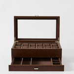 The TAWBURY Bayswater 12 Slot Watch Box with Storage in Chestnut Brown features a glass lid, twelve top compartments, and an open lower drawer—ideal for organizing and displaying your timepiece collection.