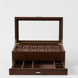 The TAWBURY Bayswater 12 Slot Watch Box with Storage in Chestnut Brown features a glass lid, twelve top compartments, and an open lower drawer—ideal for organizing and displaying your timepiece collection.