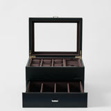 The TAWBURY Bayswater 6 Watch Jewelry Box - Midnight Black features a glass lid, multiple top compartments, a pull-out drawer with extra sections, and brown fabric lining—perfect for organizing your men's watch collection.