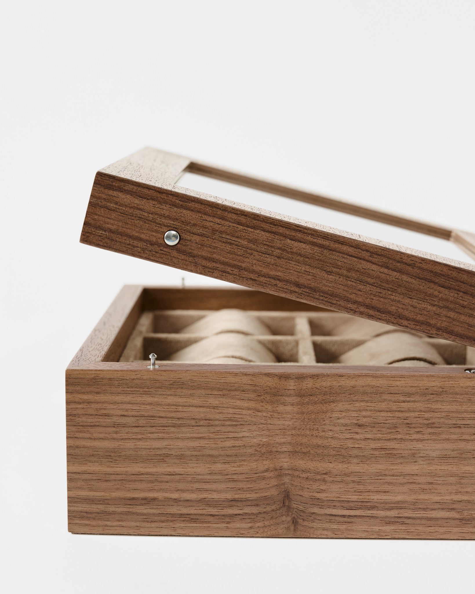 The TAWBURY Grove 6 Slot Wooden Watch Box in Light Walnut features a glass lid and multiple compartments—an elegant storage solution for watch enthusiasts.