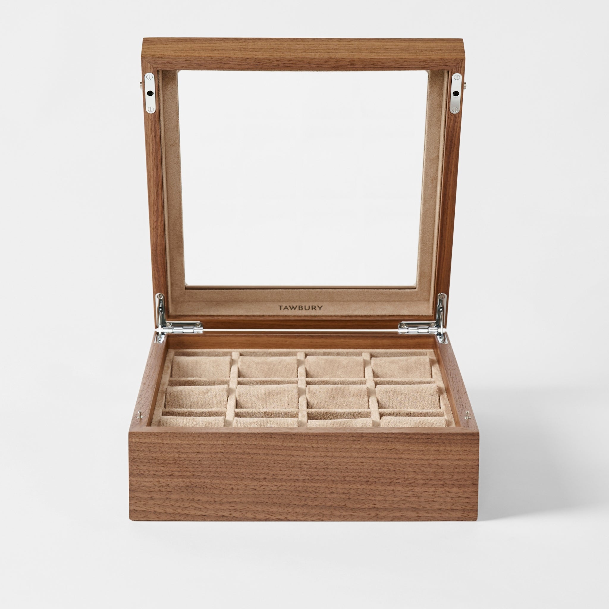 The TAWBURY Grove 12 Slot Wooden Watch Box in classic walnut wood features a glass lid and beige cushioned compartments, making it the ideal display case for organizing your watch or jewelry collection.