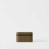 The TAWBURY Fraser 4 Watch Case in Truffle Taupe is a small rectangular leather travel case with a textured surface and zipper, perfect for storing 4 watches, displayed on a plain white background.
