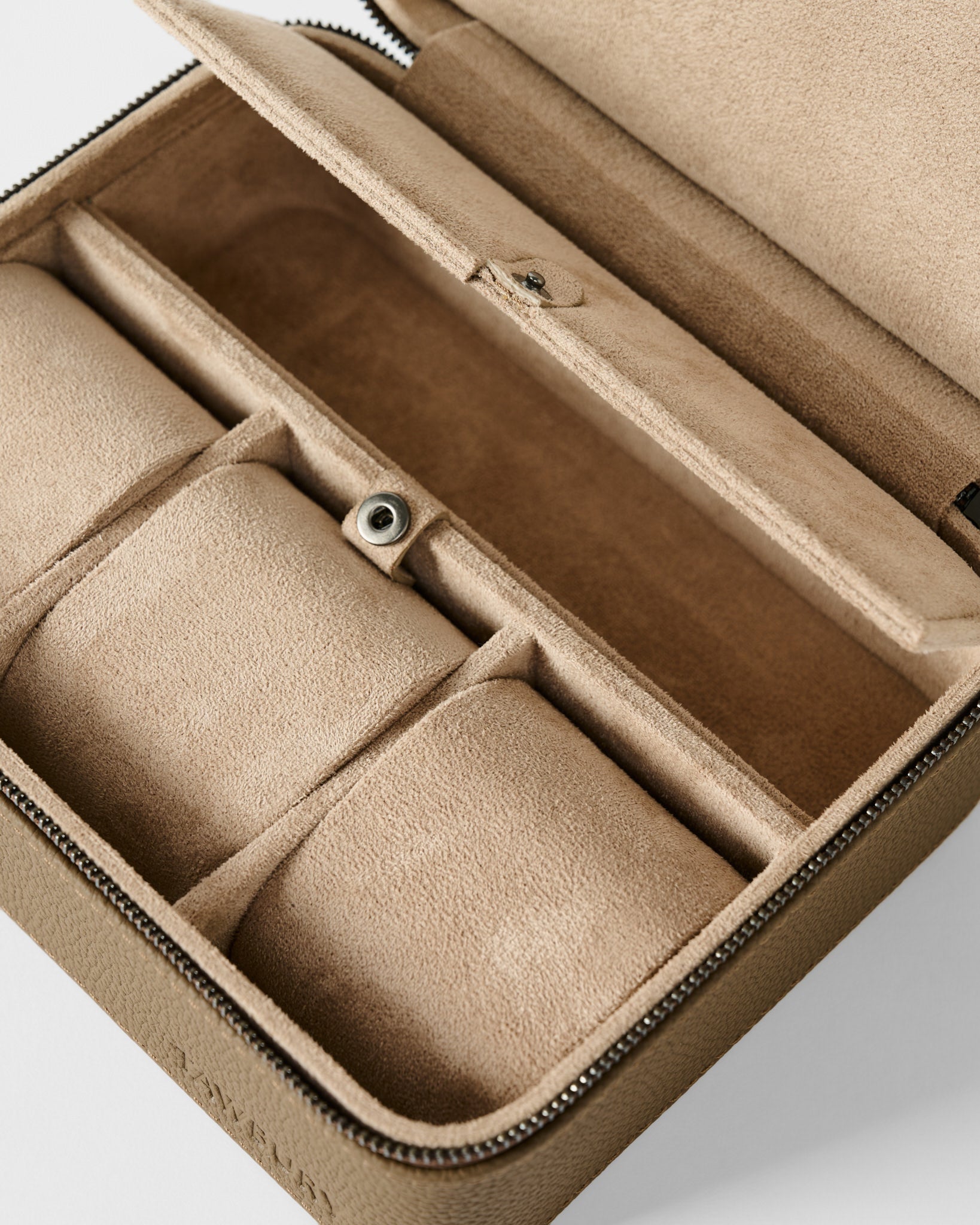 The TAWBURY Fraser 3 Watch Case with Storage in taupe features a zippered closure, multiple padded compartments, and a suede-like interior for elegant watch storage.
