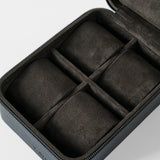 The TAWBURY Fraser 4 Watch Case - Black features four soft, suede-like padded compartments and a zippered leather exterior, designed to securely store and protect your watches or small accessories.